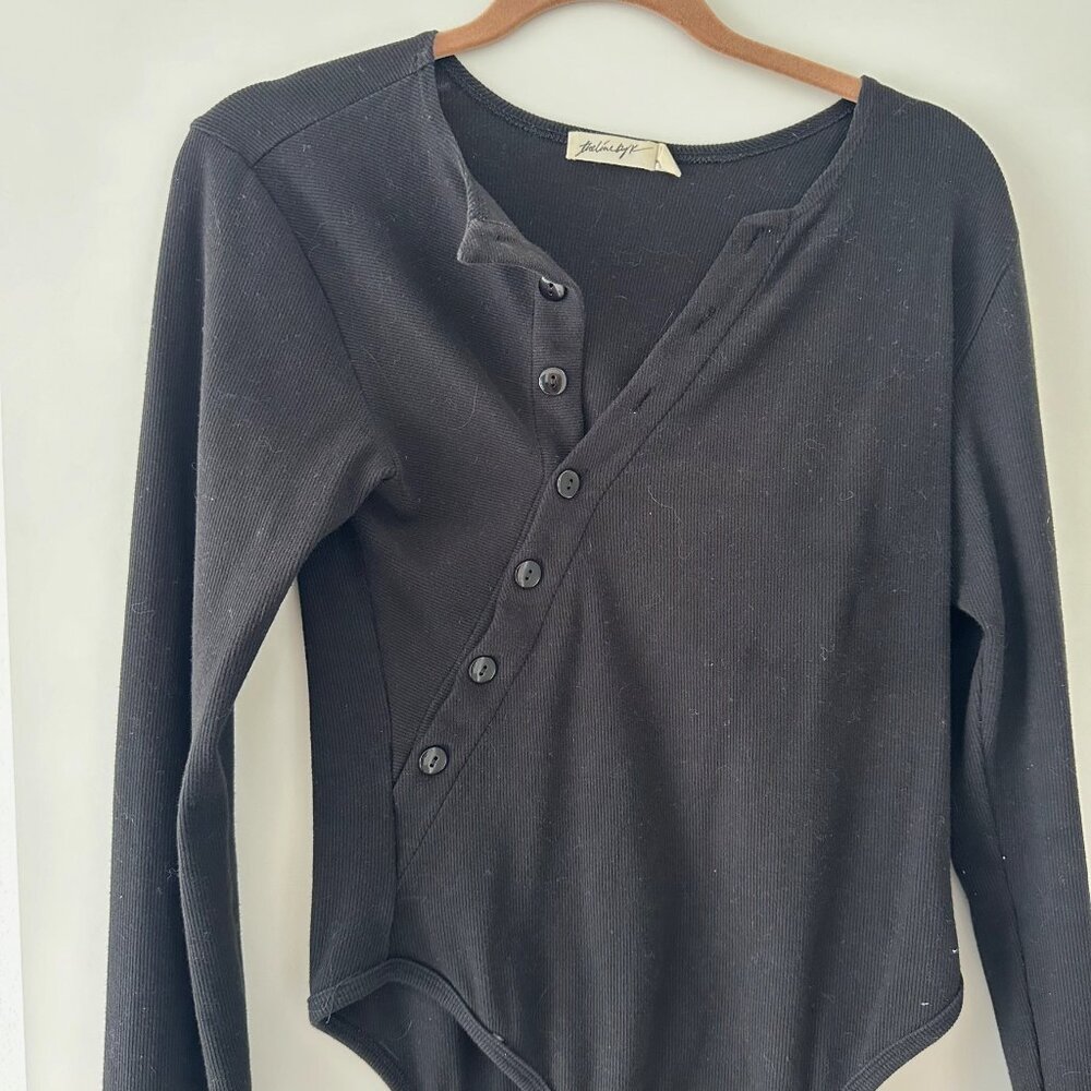 the line by k Evelyn Asymmetrical Henley Bodysuit in black